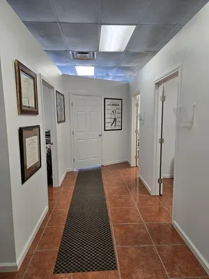 A long hallway with doors.