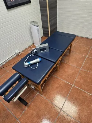 A blue therapy table.