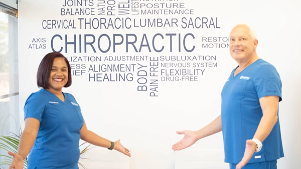 Candace Holmes And Gorm Laursen Smiling in blue srubs