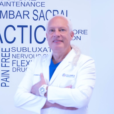 Gorm Laursen smiling in a white coat.